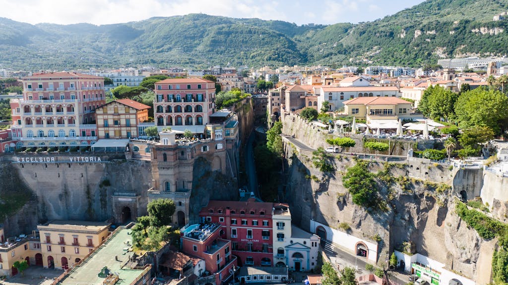A picturesque aerial view showcasing the charming town of Sorrento, Italy, with iconic cliffside buildings.