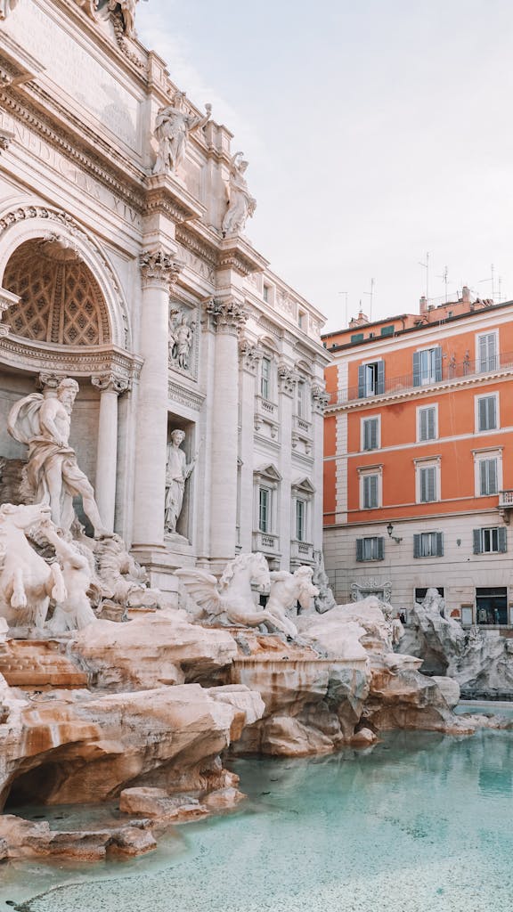 A tranquil view of the iconic Trevi Fountain in Rome, showcasing its detailed sculptures and clear water.