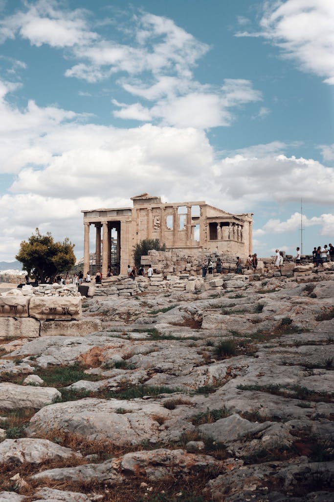 Explore the historic Acropolis in Athens, Greece, showcasing ancient ruins against a vibrant sky.