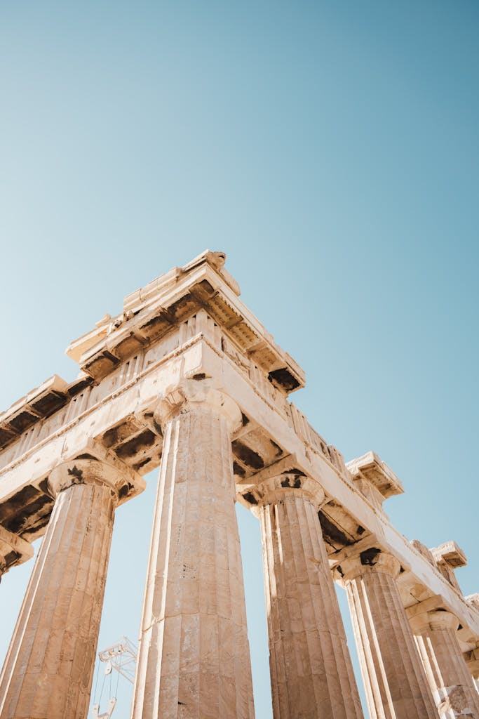 Low-angle shot of the iconic Parthenon showcasing its ancient columns against a clear sky.