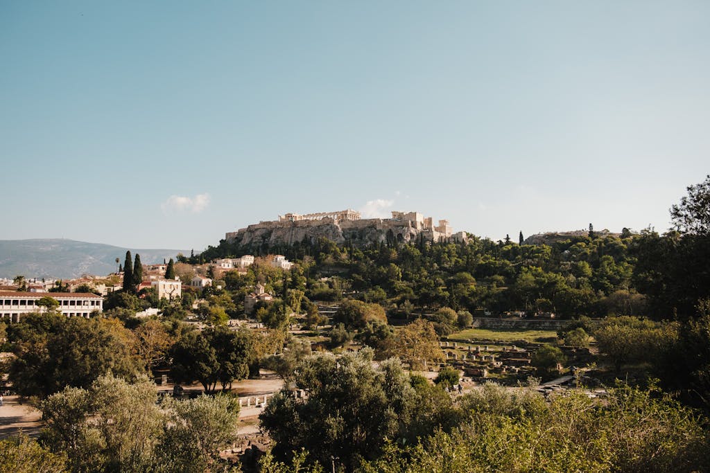 Explore the historic Acropolis, a landmark in Athens, surrounded by lush greenery.