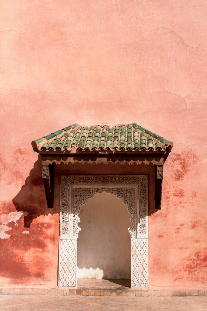 white clay door against a pink clay wall