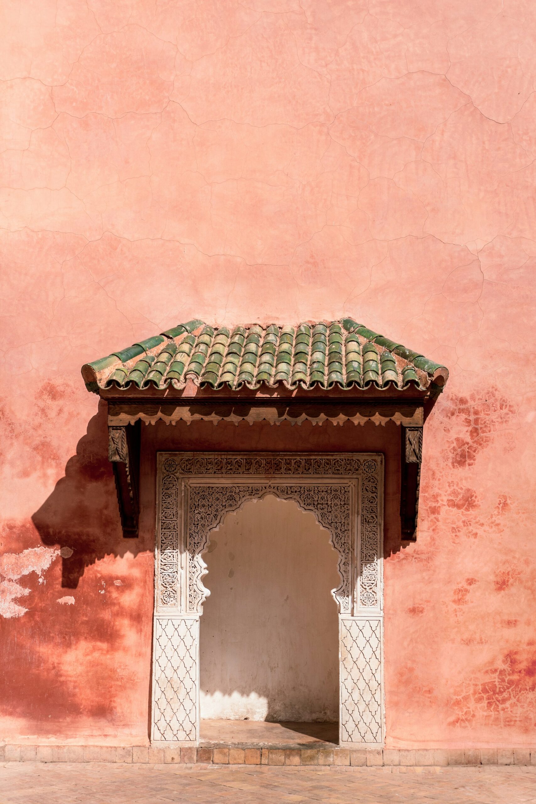 white clay door against a pink clay wall