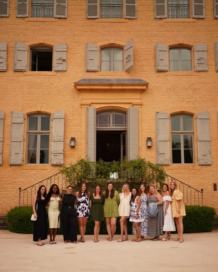group of women in front of a building
