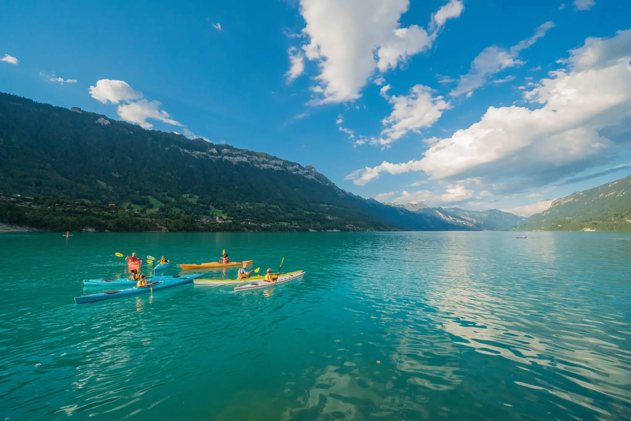 canoe on a bright blue lake in switzerland