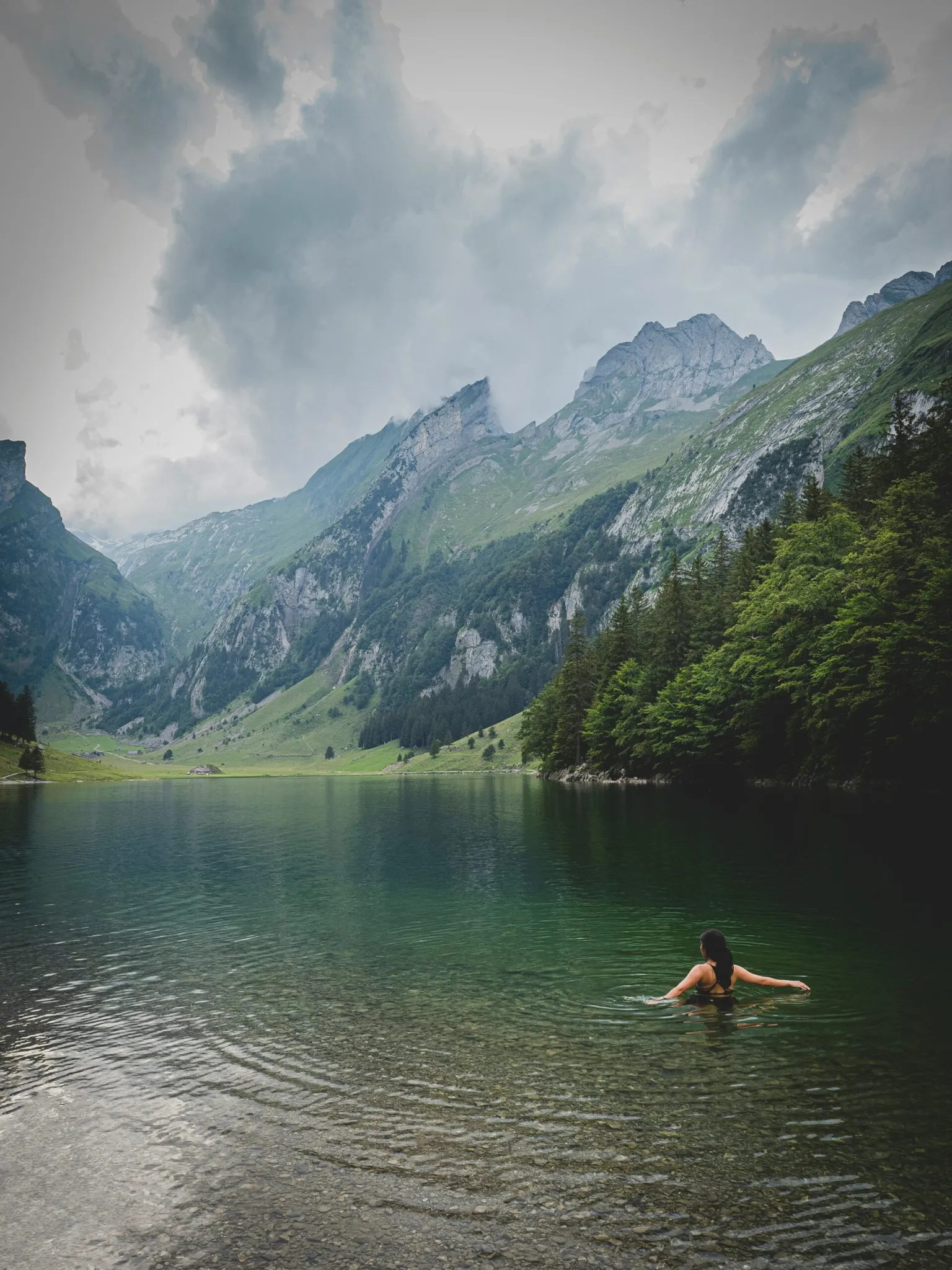 woman in a lake in the mountains