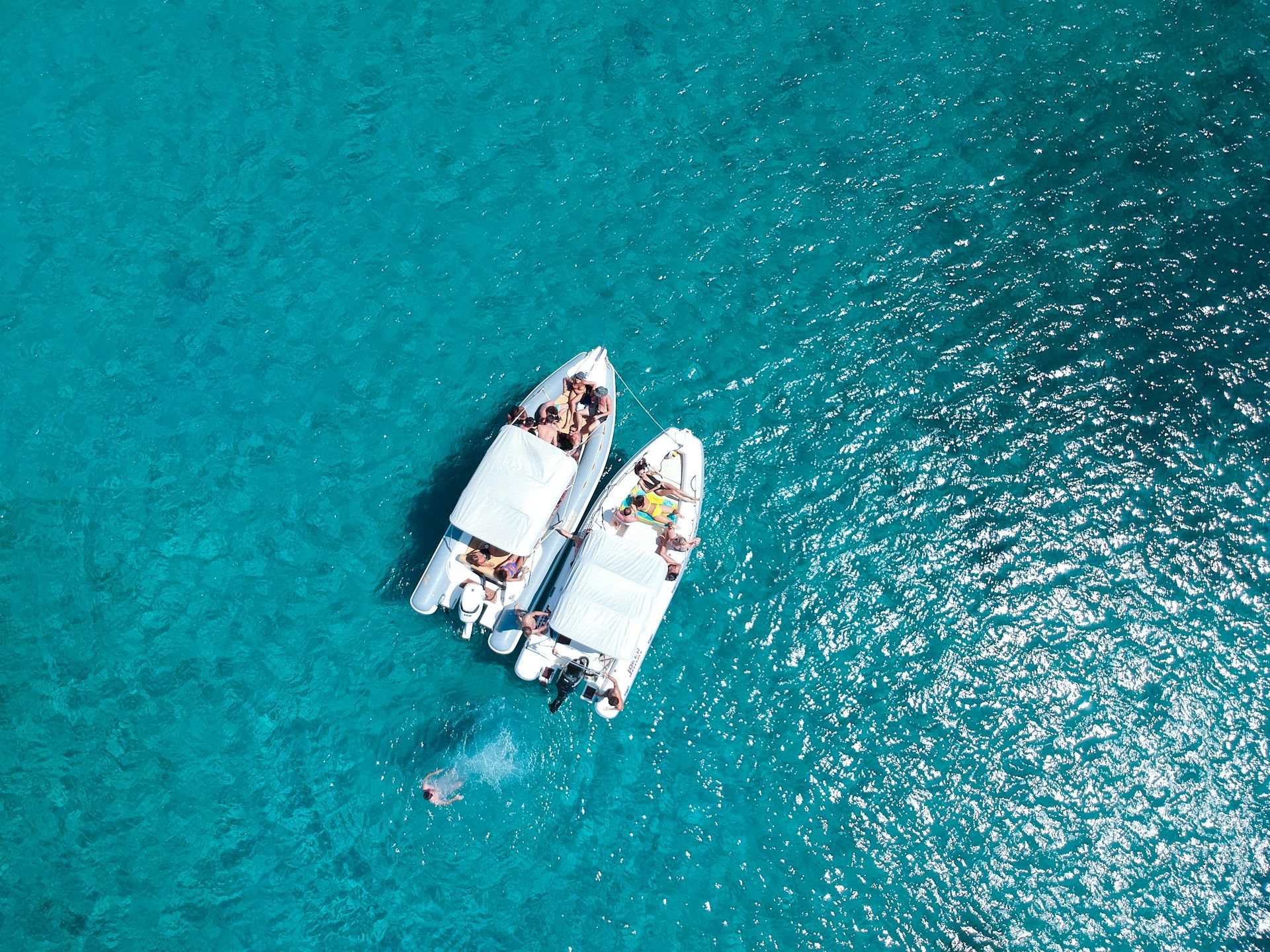 birds eye view of two boats side by side
