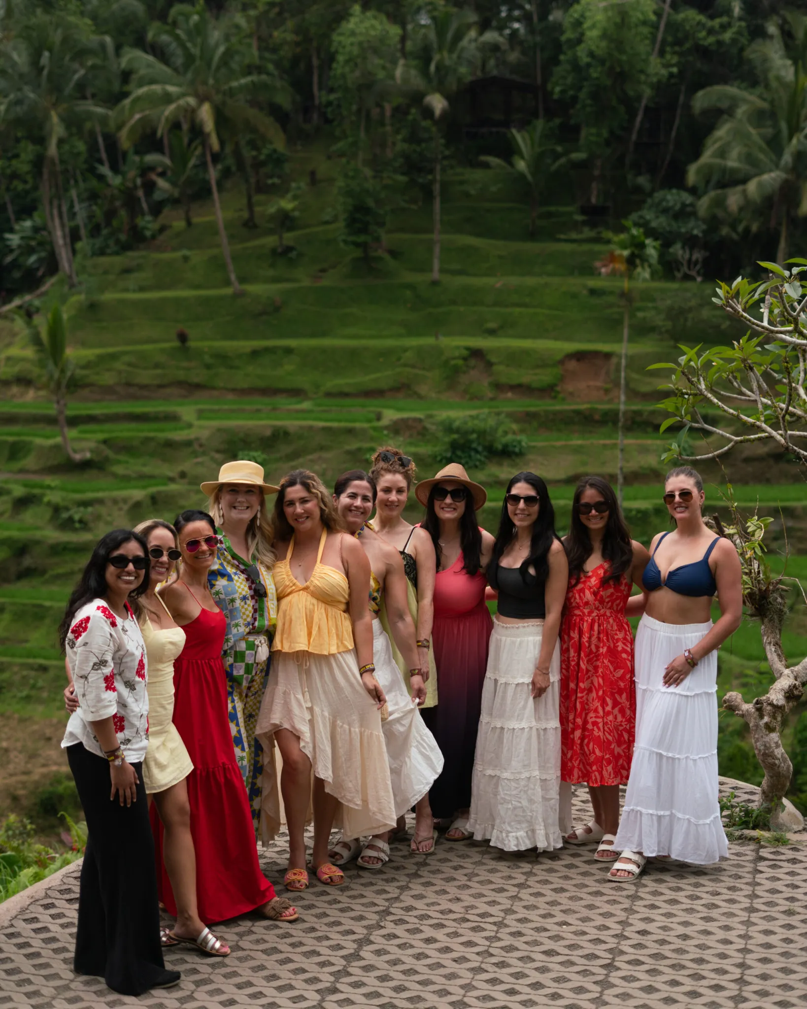 group of women in front of rice fields in bali indonesia