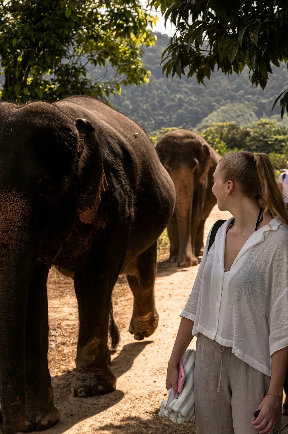 woman next to elephant